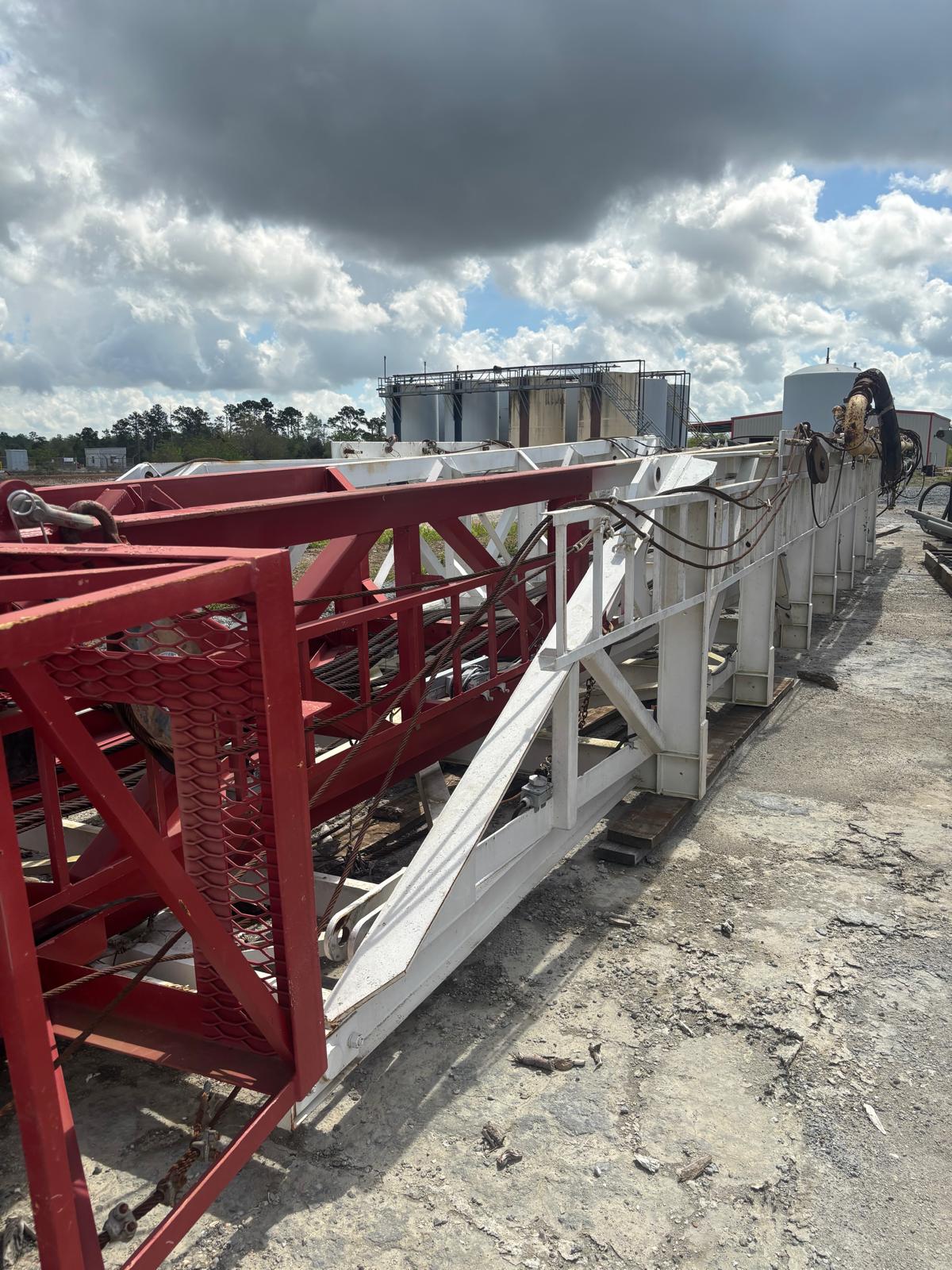 Drilling rig mast and structures in the yard